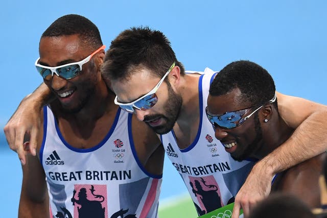 Britain's Matthew Hudson-Smith (left), Martyn Rooney (centre) and Nigel Levine react after competing in the men's 4x400m relay