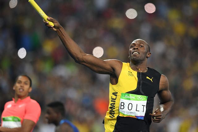 Bolt celebrates after crossing the line first in the men's 4x100m relay