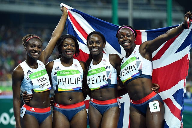 Great Britain's Dina Asher-Smith, Asha Philip, Daryll Neita and Desiree Henry celebrate taking bronze