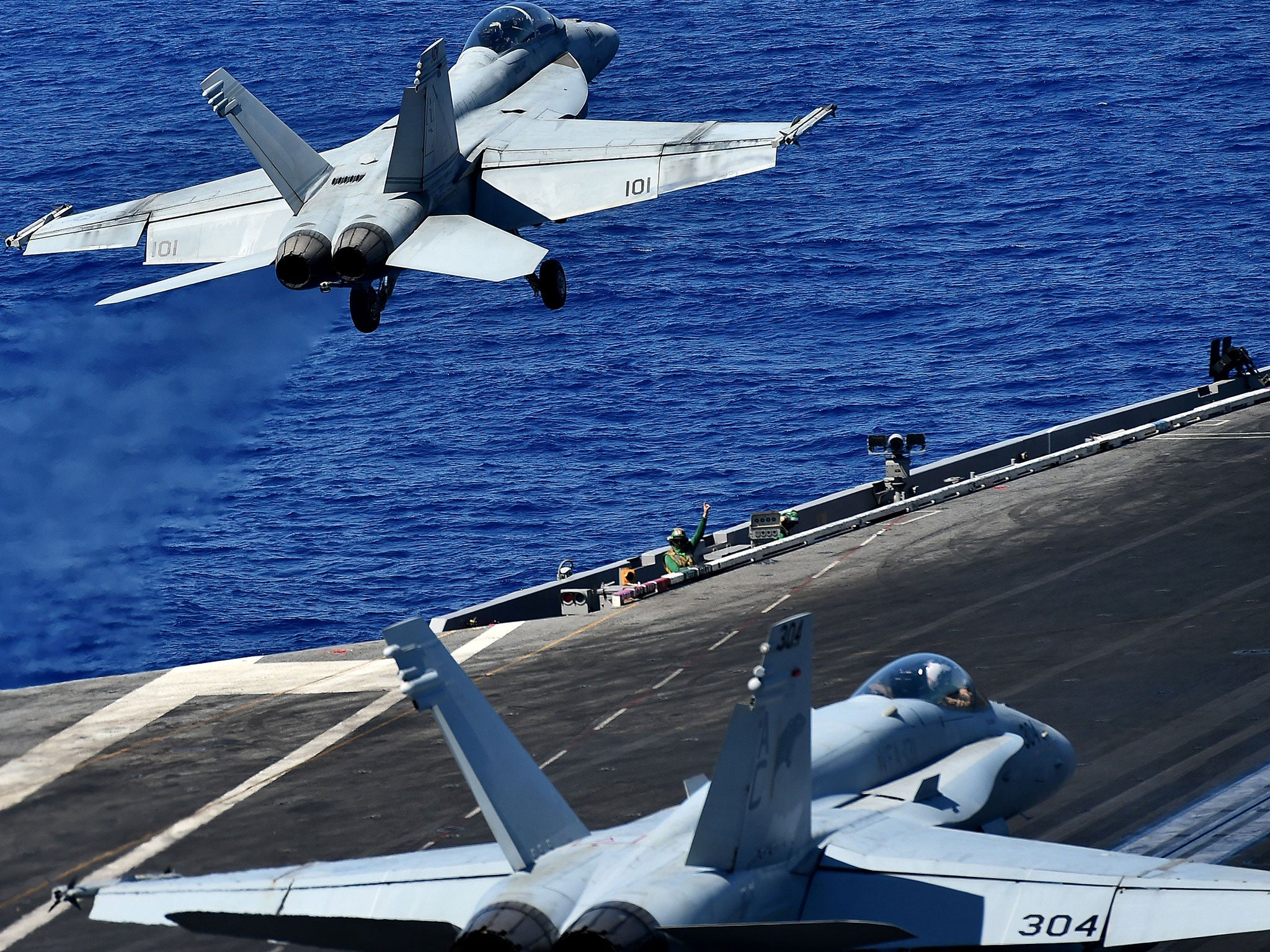 An F-18 takes off from the US Navy's USS Dwight D. Eisenhower to carry out air strikes on 7 July 2016.