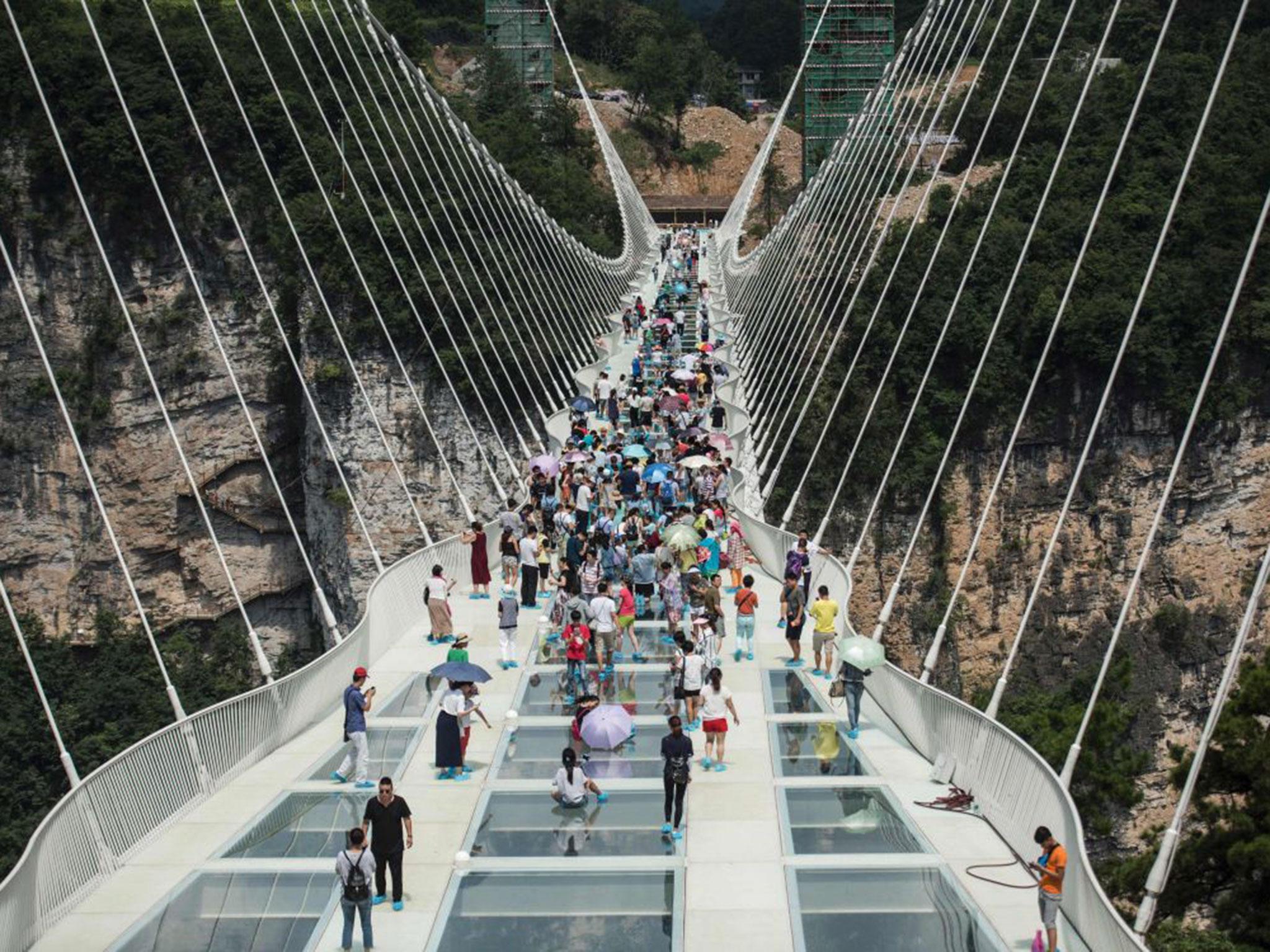 China Opens Worlds Highest And Longest Glass Bottomed Bridge The