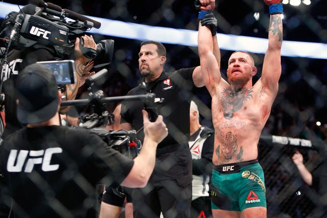 Conor McGregor celebrates his victory over Nate Diaz at UFC 202