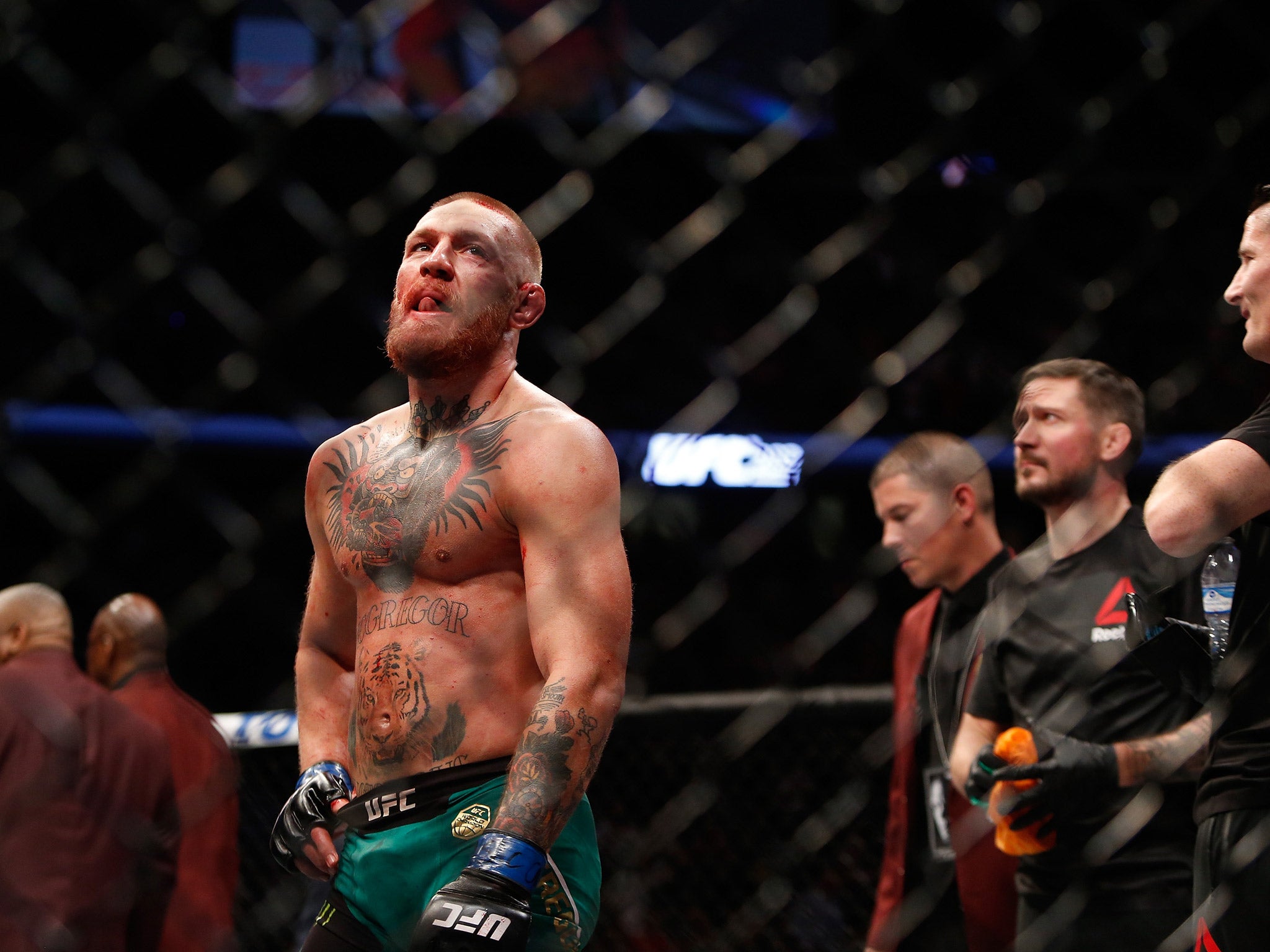 Conor McGregor reacts at the end of his fight with Nate Diaz