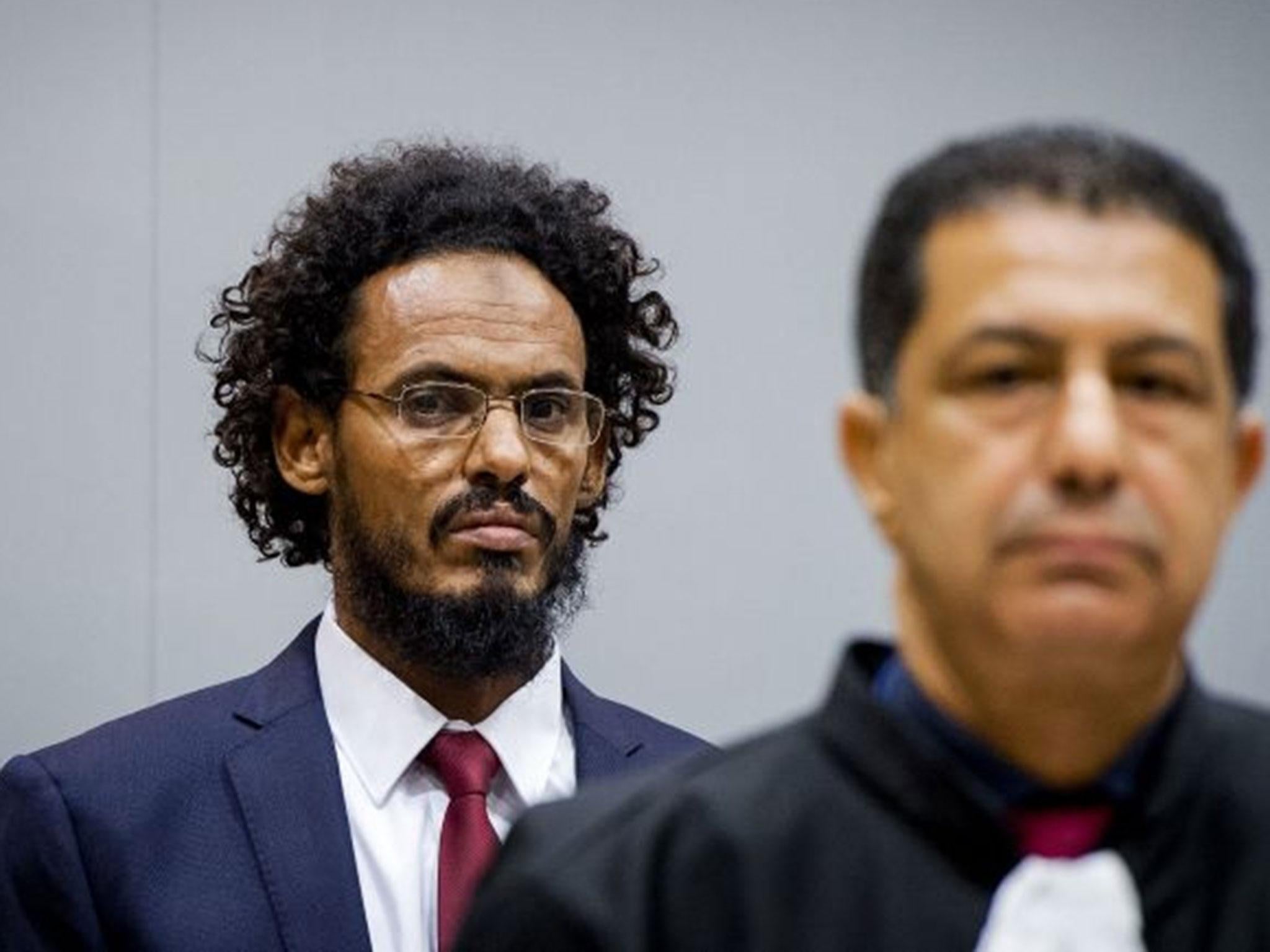 This file photo taken on 30 September, 2015 shows alleged Al-Qaeda-linked Islamist leader Ahmad Faqi Al Mahdi (left) looking on in the courtroom of the International Criminal Court (ICC) in The Hague