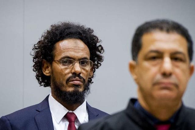 This file photo taken on 30 September, 2015 shows alleged Al-Qaeda-linked Islamist leader Ahmad Faqi Al Mahdi (left) looking on in the courtroom of the International Criminal Court (ICC) in The Hague
