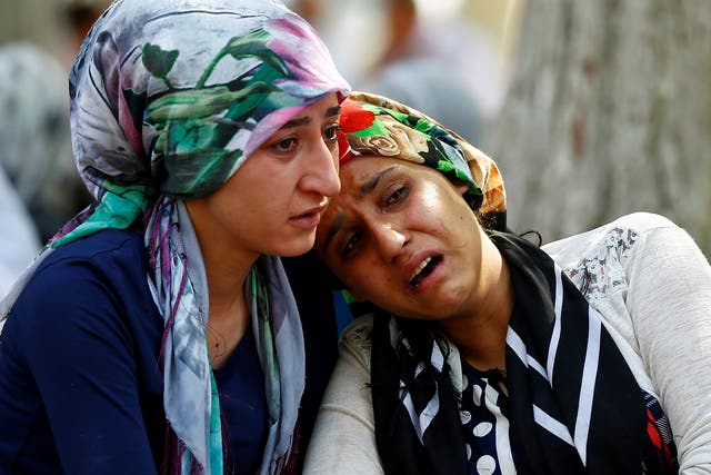 Women mourn as they wait in front of a hospital morgue in the Turkish city of Gaziantep