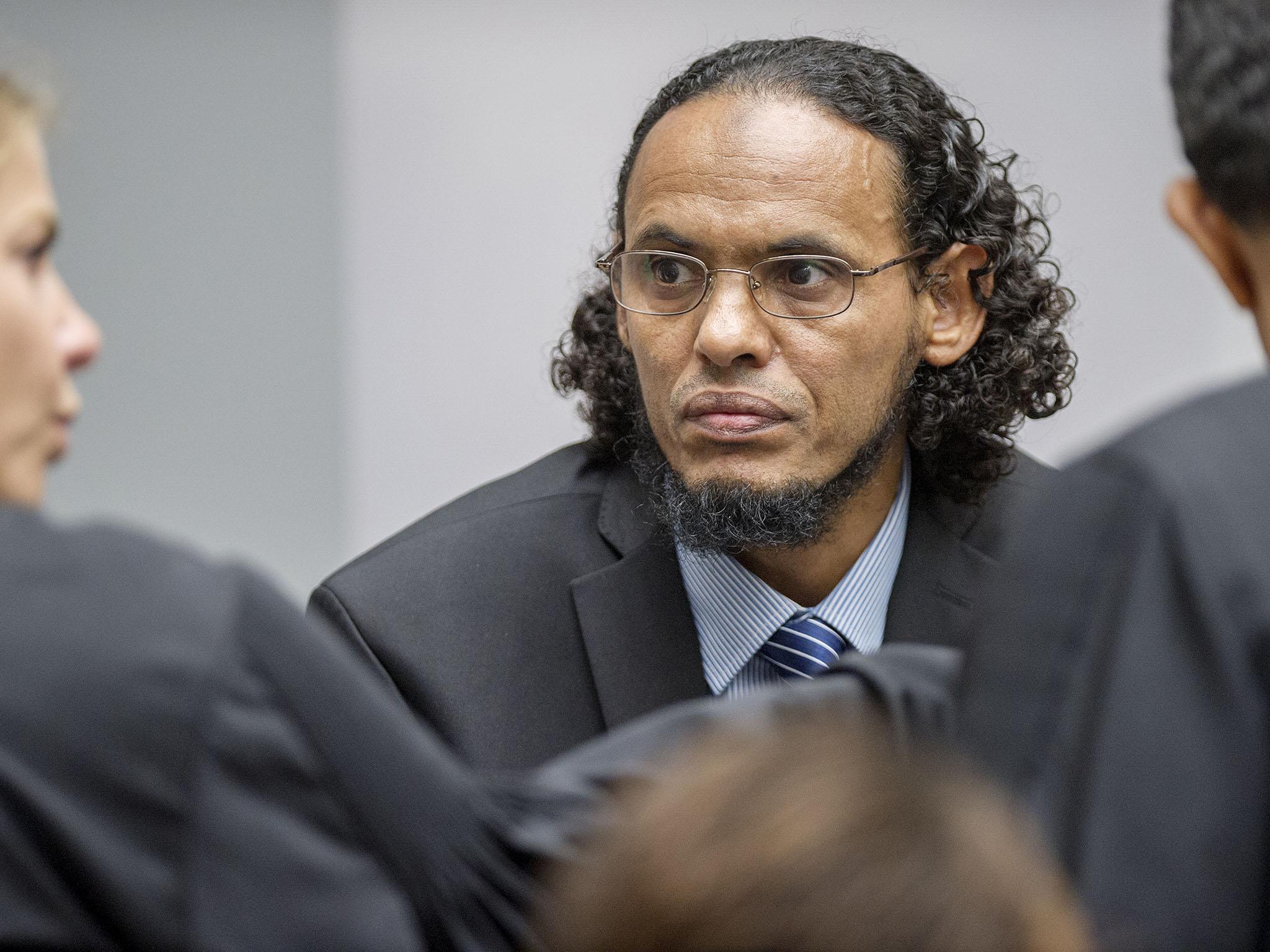 Ahmad Al Faqi Al Mahdi, center, appears at the International Criminal Court in The Hague, Netherlands