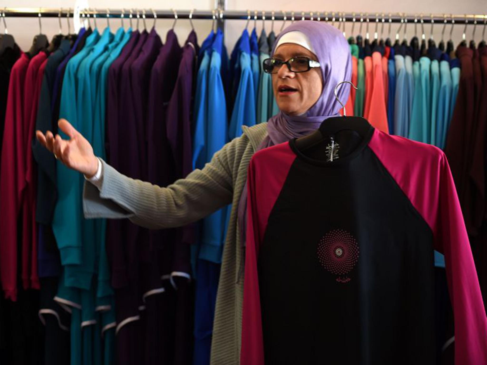 Australian-Lebanese designer Aheda Zanetti explains her products of burkini swimsuits at a shop in western Sydney