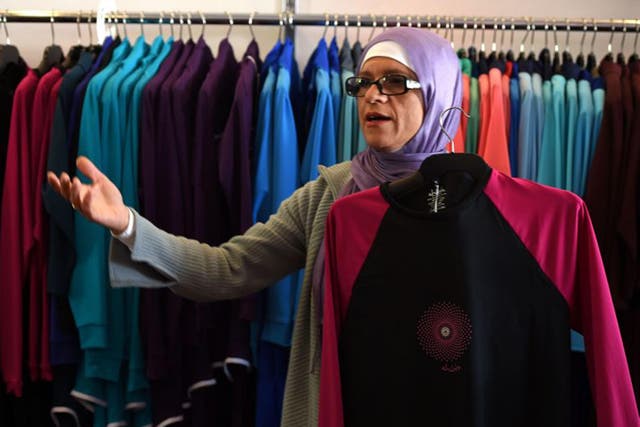 Australian-Lebanese designer Aheda Zanetti explains her products of burkini swimsuits at a shop in western Sydney