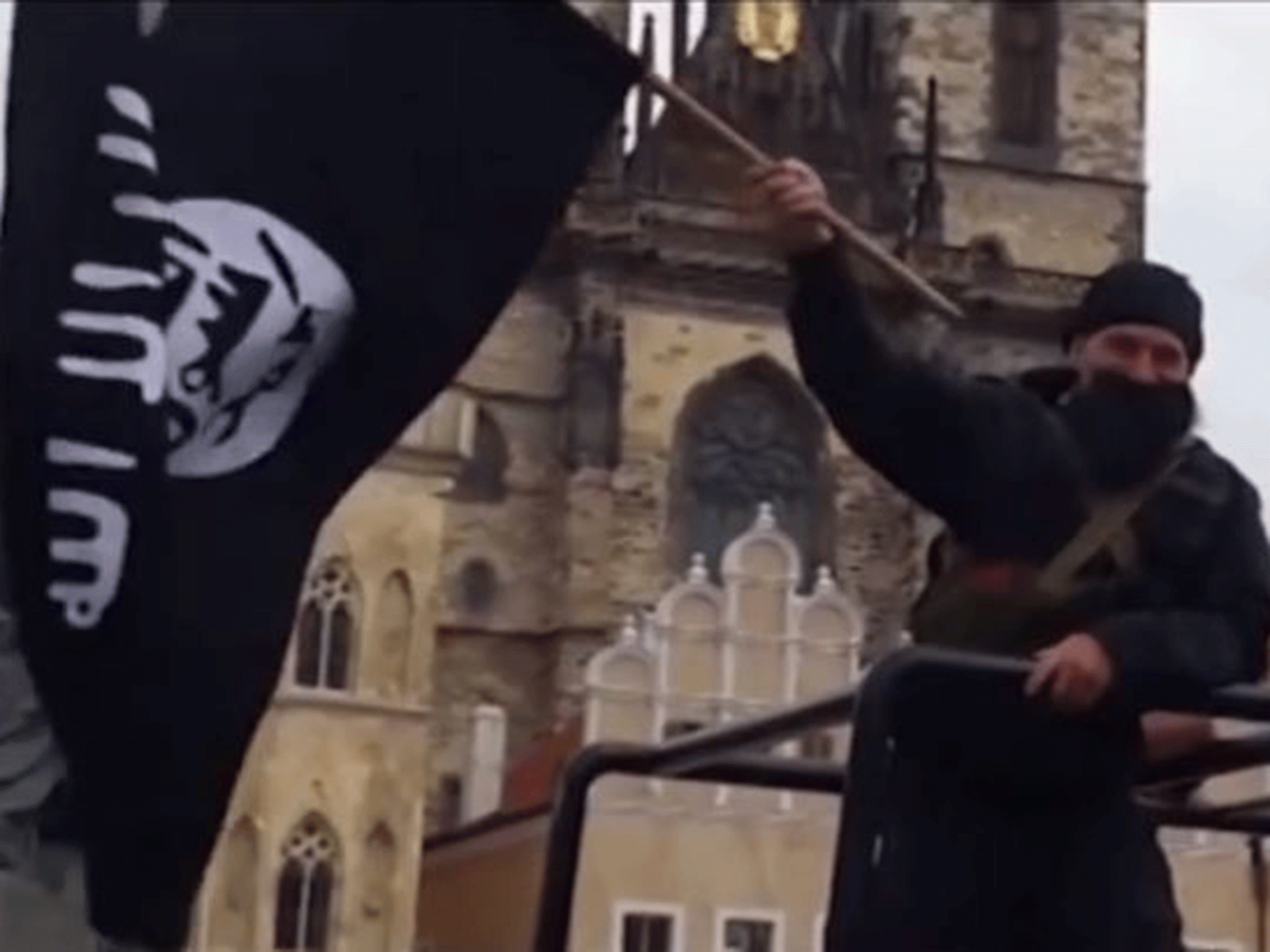 Men with detachable beards waved fake Isis flags in a demonstration approved by Prague's City Hall officials