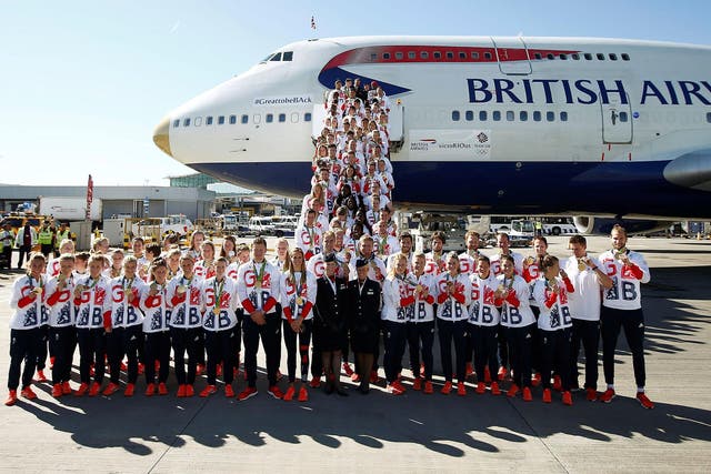 The medal-laden British team arrives at Heathrow from Rio