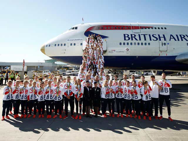 Team GB athletes pose for a photograph as they return home from the 2016 Rio Olympics, at Heathrow Airport in London