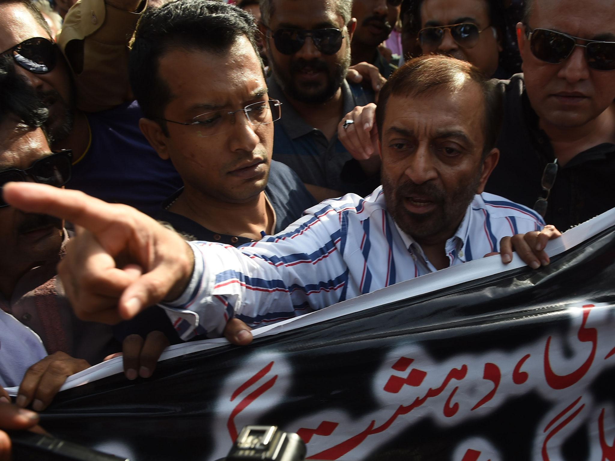 Senior MQM party leader Farooq Sattar arrives for a press conference in Karachi where he issued a rare public rebuke of the party’s London-based leader Altaf Hussain