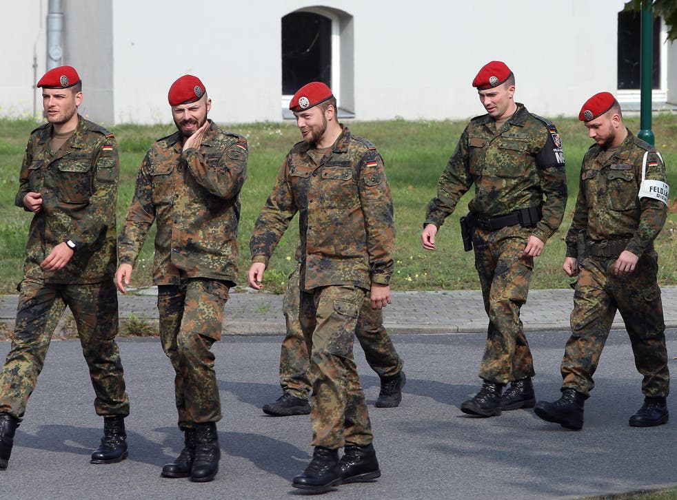German soldiers walk through the Julius-Leber-Kaserne military barracks