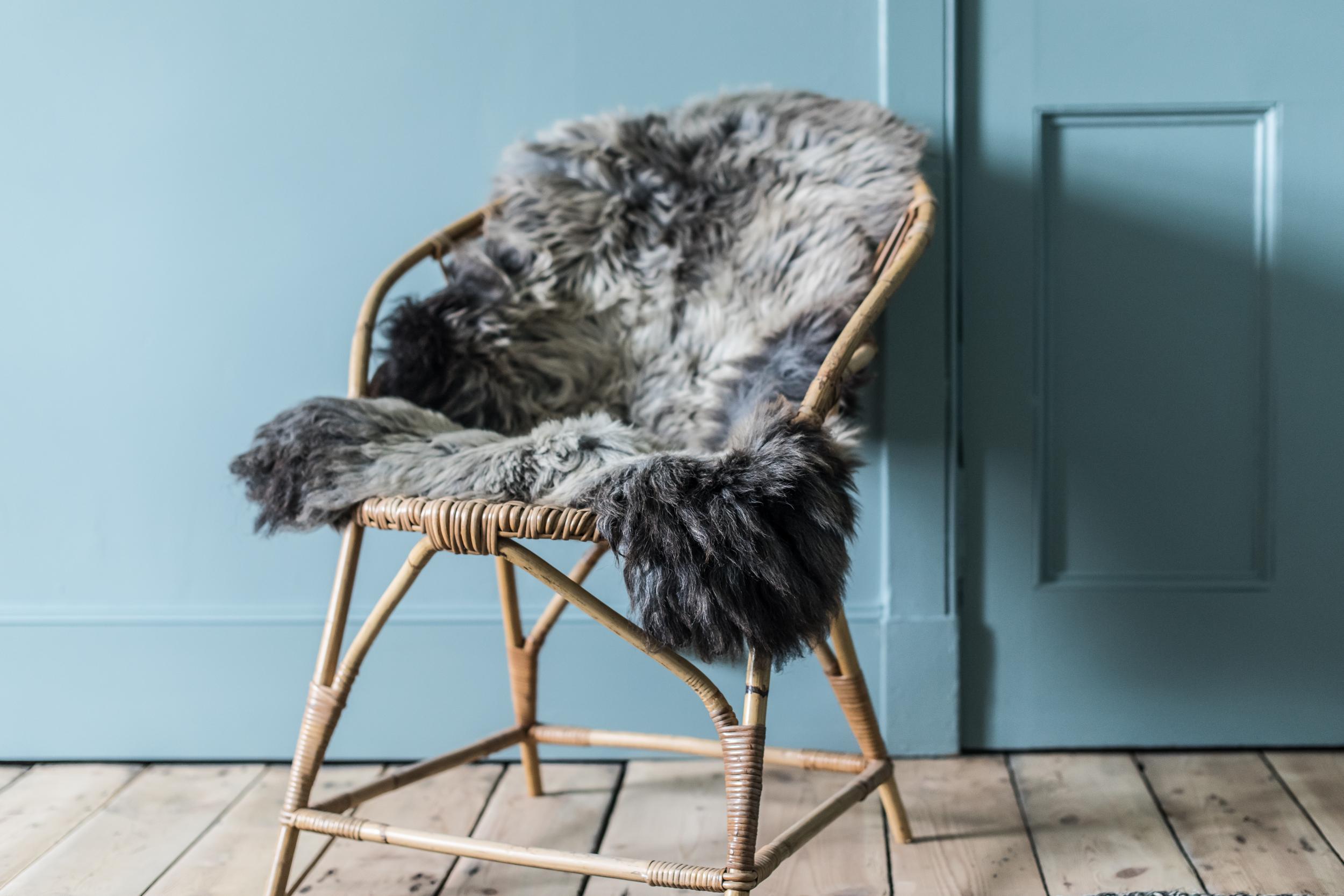 Stylish touches, such as this throw, include sheepskin from the Shetlands and furniture handmade by local craftsmen
