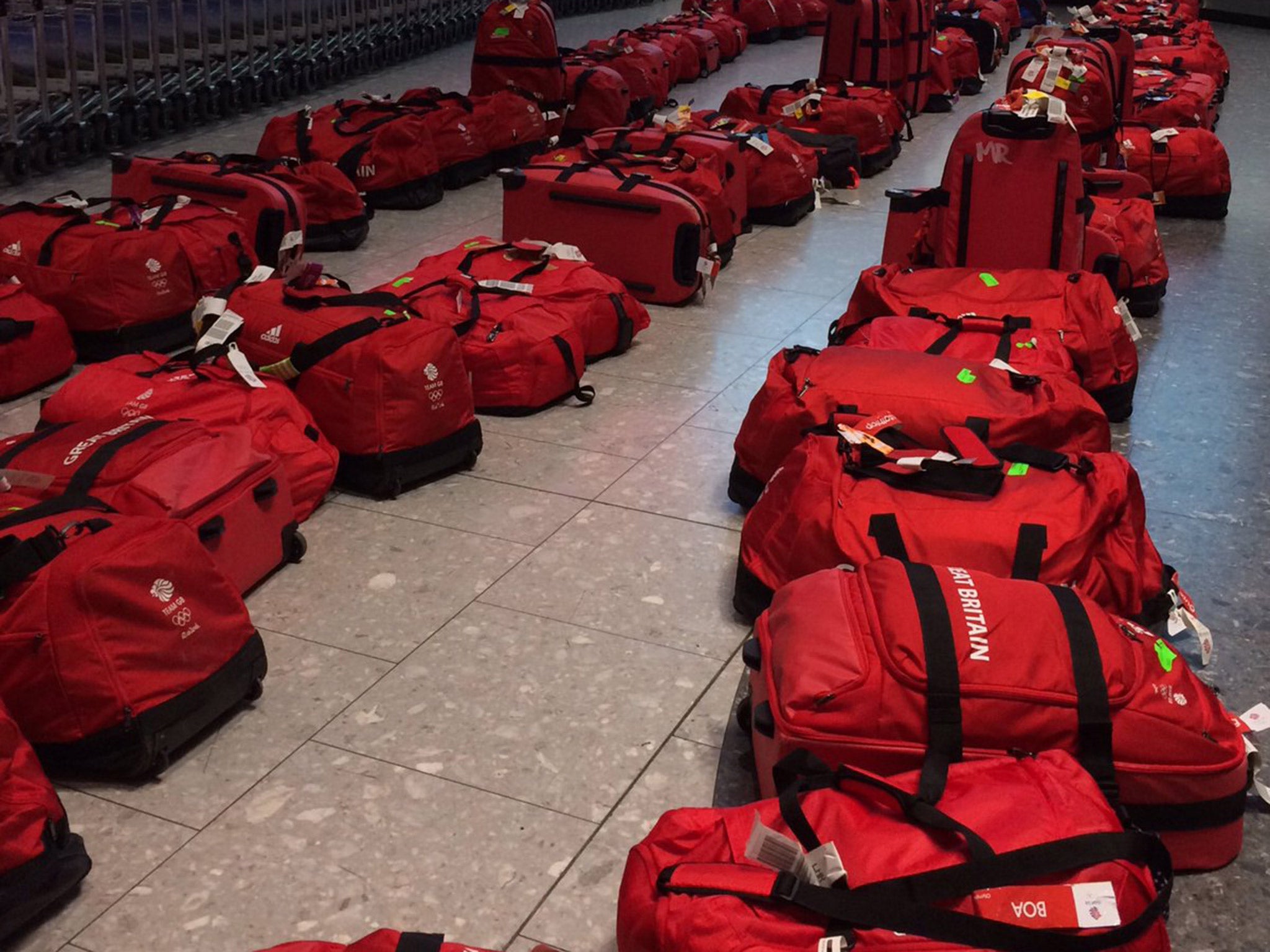 Team GB were left to collect 900 identical red bags upon their return to London Heathrow