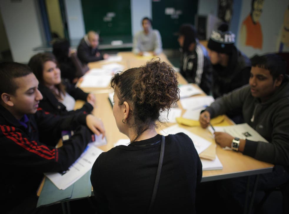 A group of young adults sit in a employability class in Newham, East London