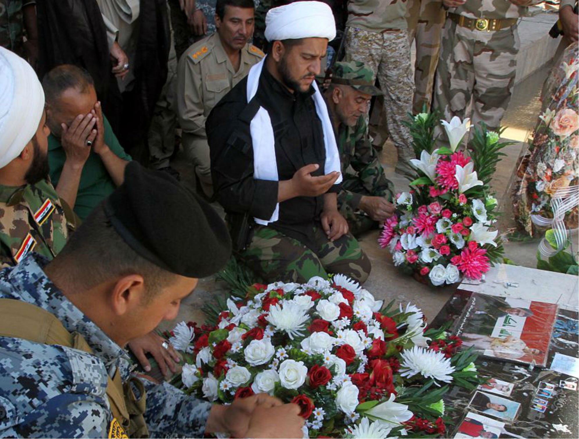 Mourners gather at the site of the 2014 massacre for which the Iraqi state has hanged 36 men