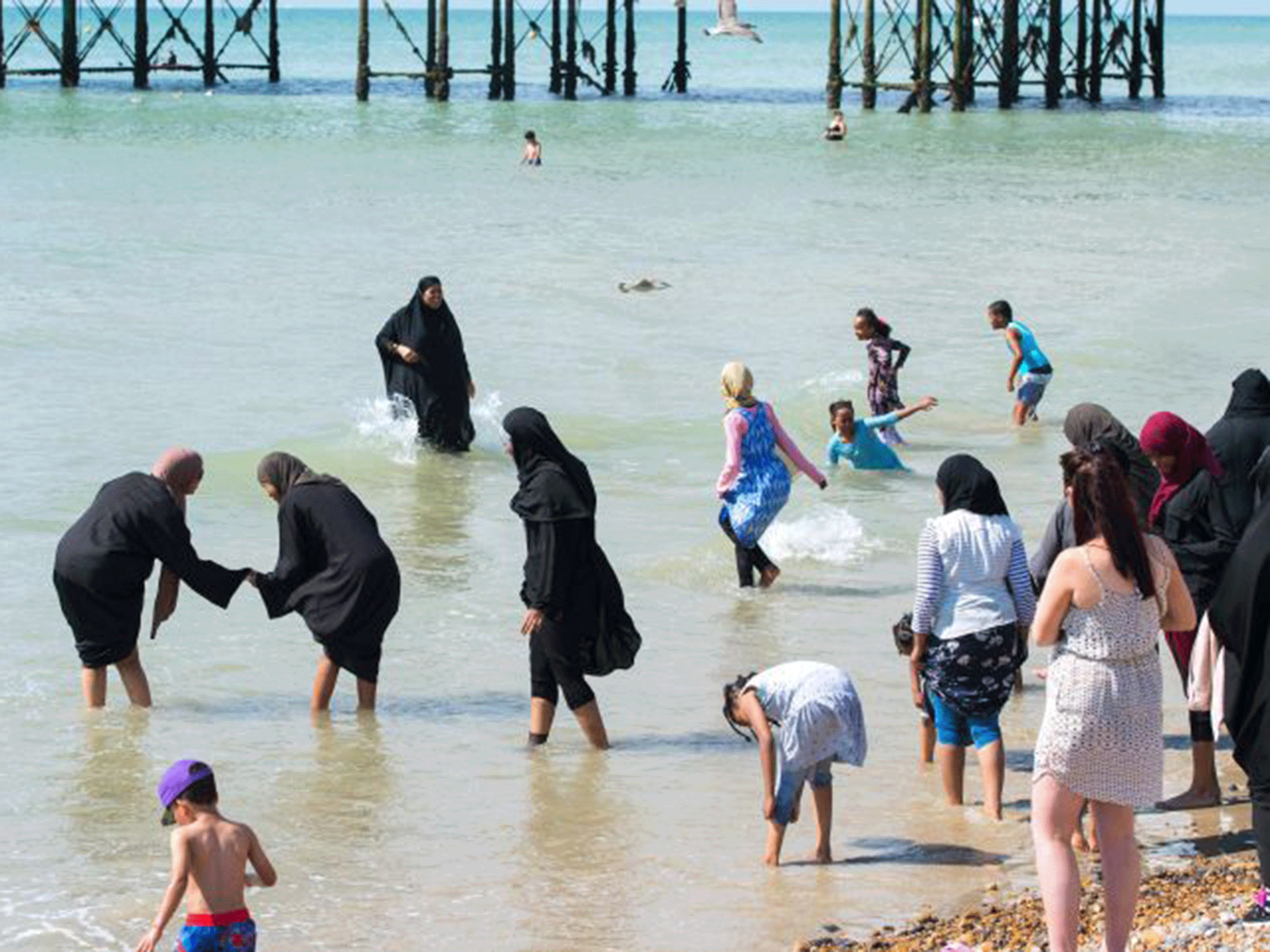 Burkini ban UK Muslims enjoy Brighton Beach in full hijab as French women face arrest The Independent The Independent pic