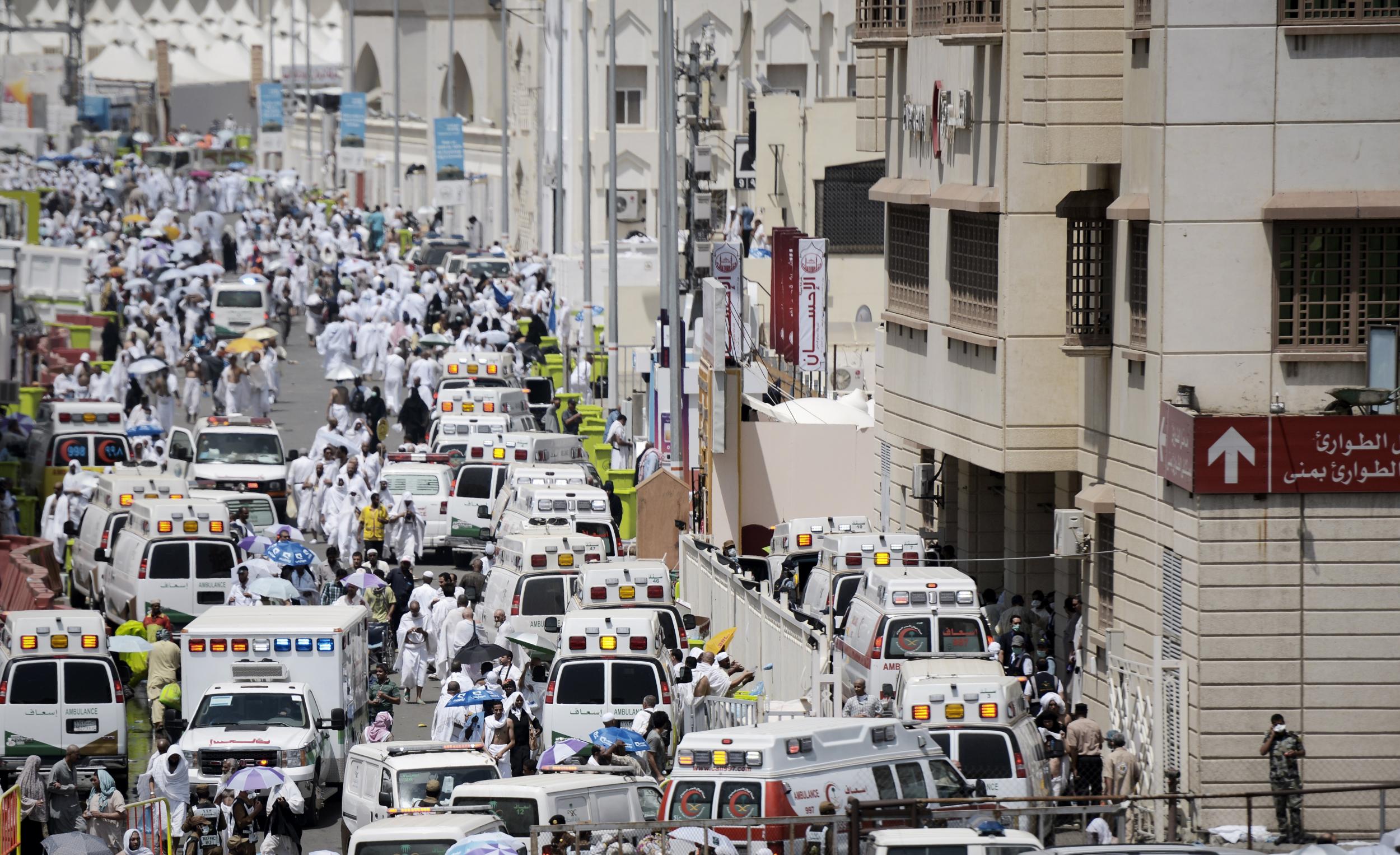 Saudi ambulances arrive with pilgrims who were injured in a stampede at an emergency hospital in Mina, near the holy city of Mecca, on the first day of Eid al-Adha in 2015