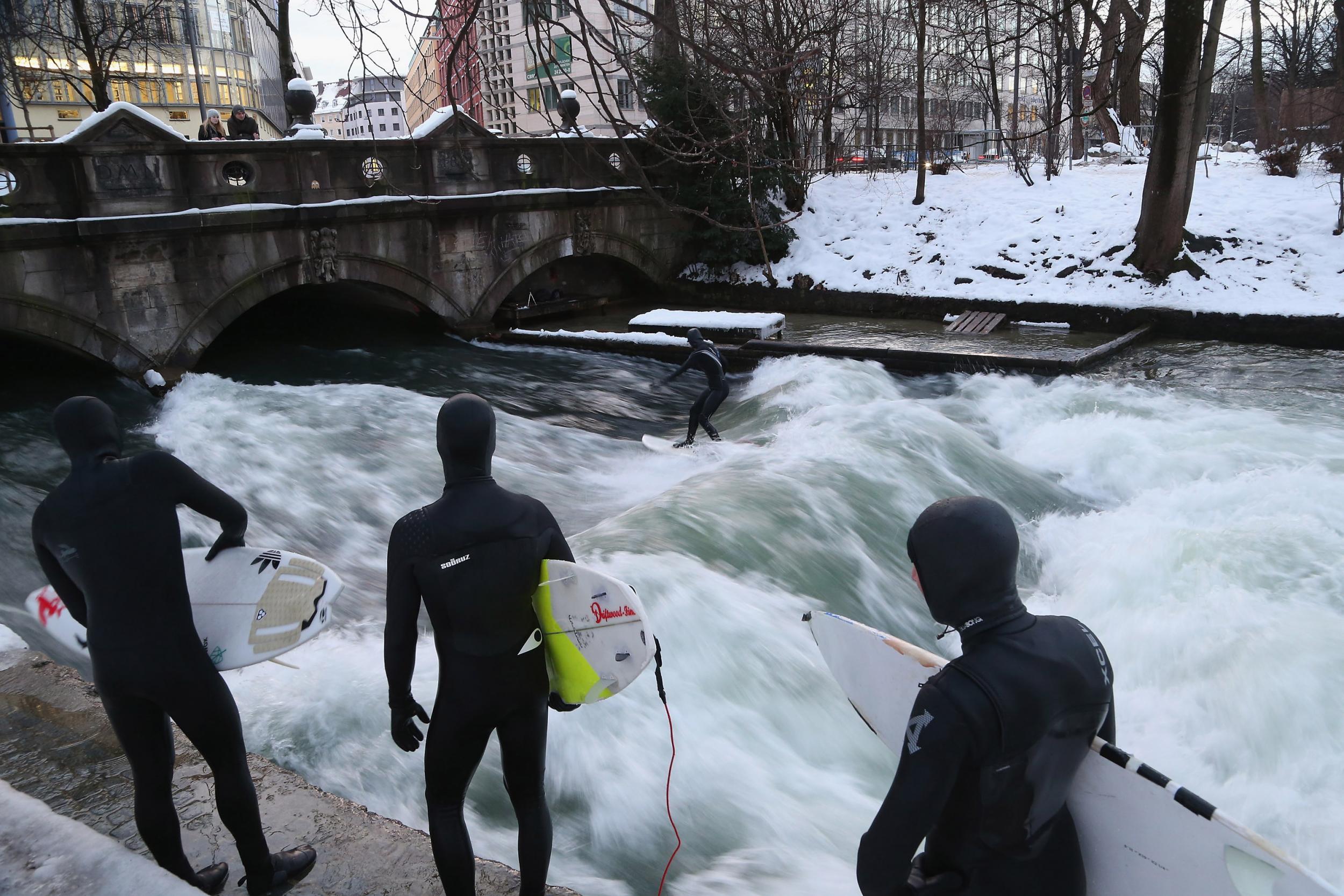 Munich's river surfers take on the wave in the English Garden park whatever the weather – even in snow