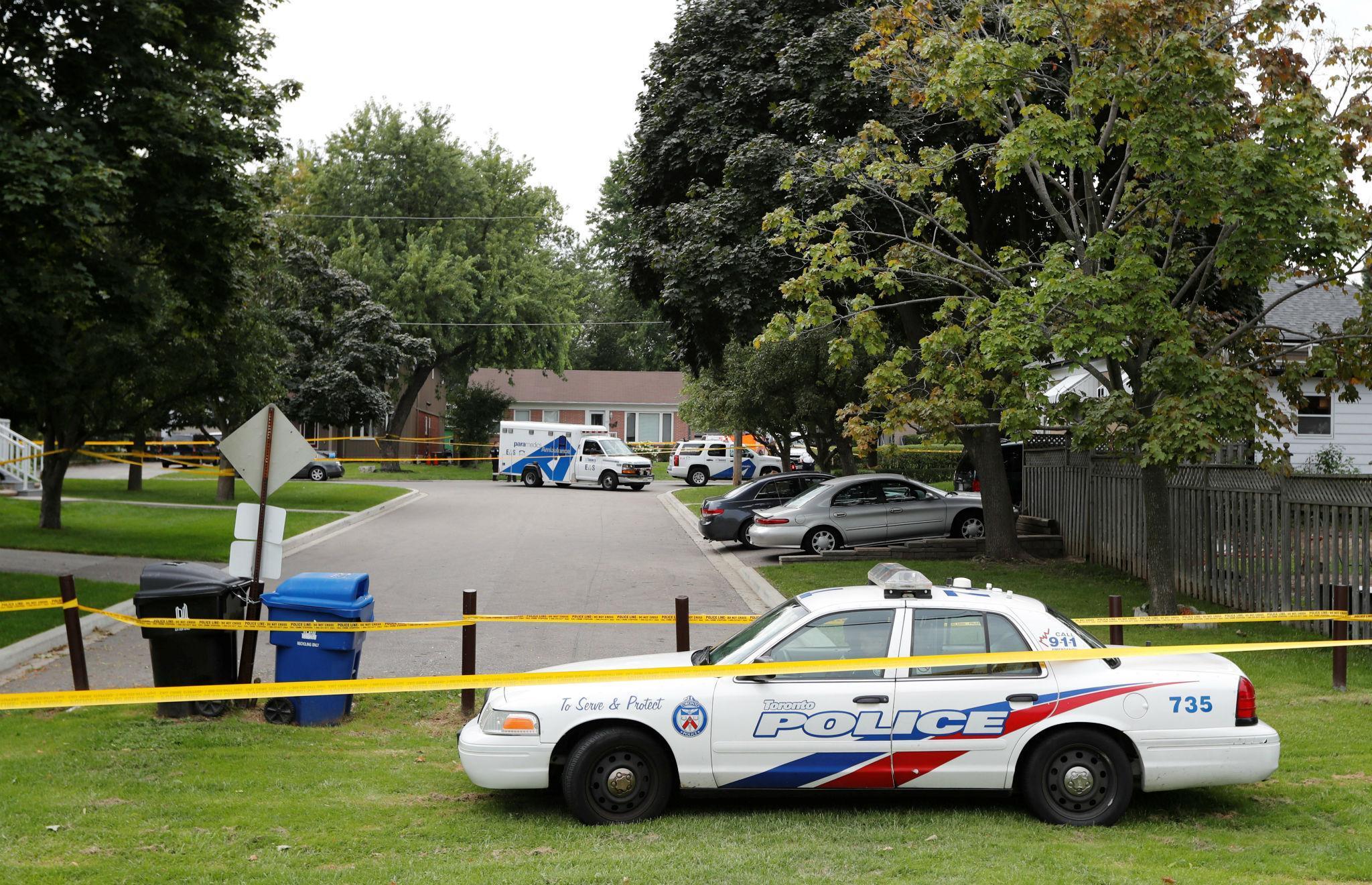 Toronto police cordoned off the area around where three people were found dead and a fourth arrested