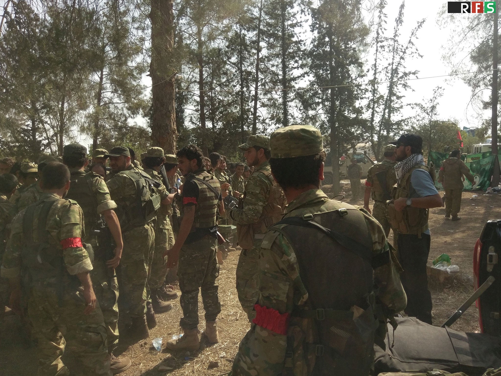 Turkish-backed gather on the outskirts of Jarablus, Syria, ahead of an offensive on 24 August 2016