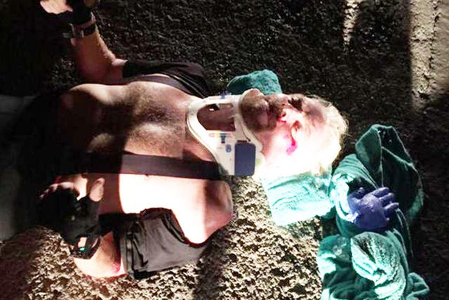 Sir Richard Branson receiving treatment after a cycling crash on the British Virgin Islands