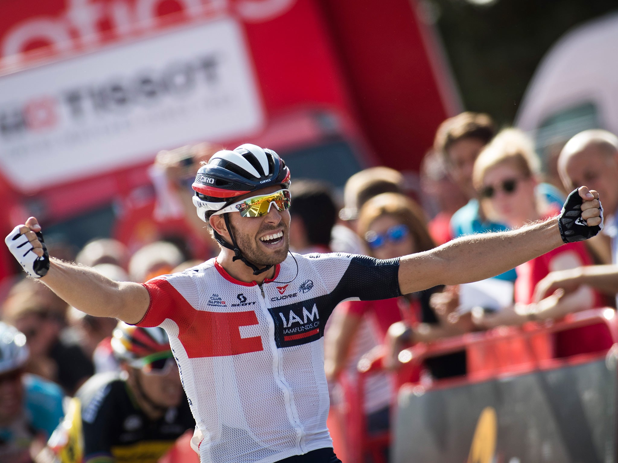 Jonas van Genechten celebrates crossing the finish line