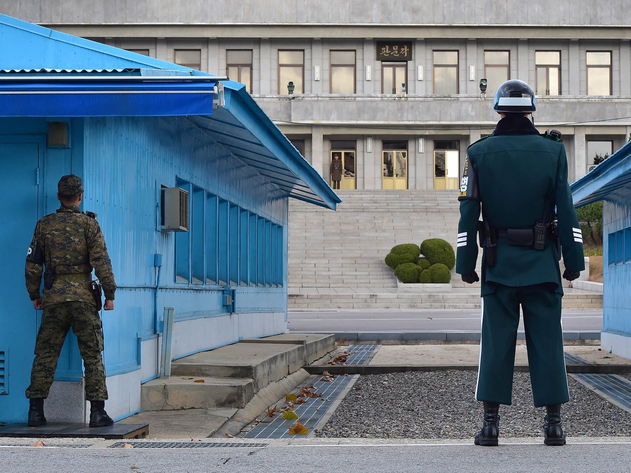 South Korean soldiers stand guard in the truce village of Panmunjom in the Demilitarised Zone dividing the two Koreas