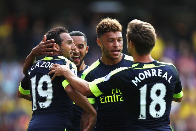 Arsenal's players celebrate following Santi Cazorla's goal