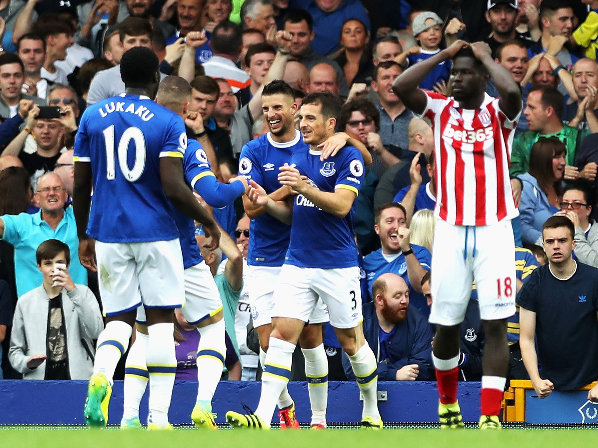 Baines is congratulated on his penalty by his Everton teammates