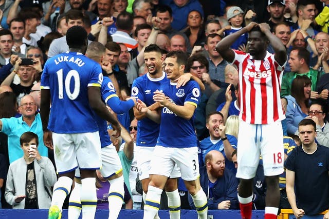 Baines is congratulated on his penalty by his Everton teammates