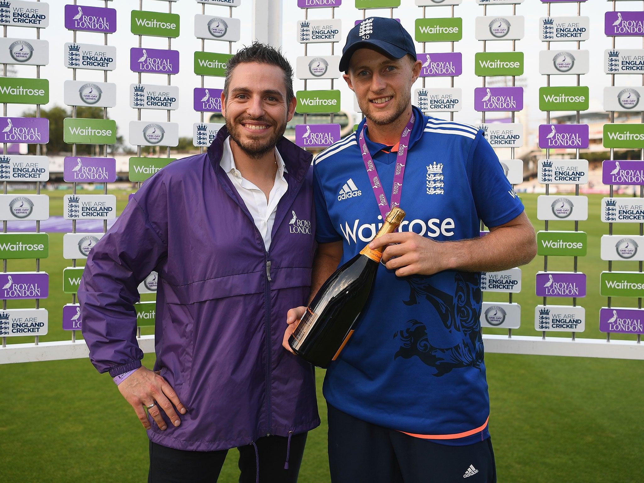 Joe Root of England receives his man of the match award during the 2nd One Day International match