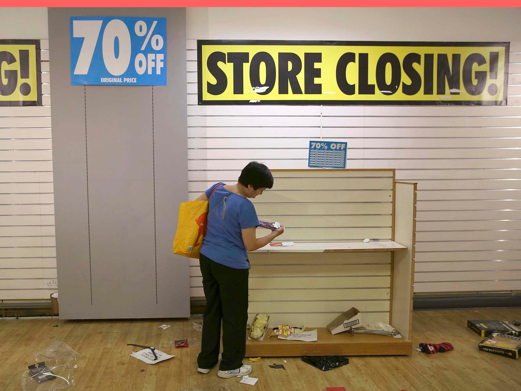 A woman shops in a branch of BHS before its final closure
