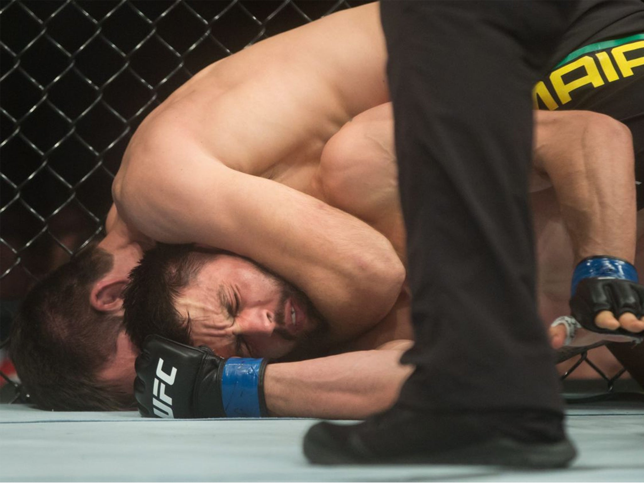 Maia, top, holds Condit in a headlock