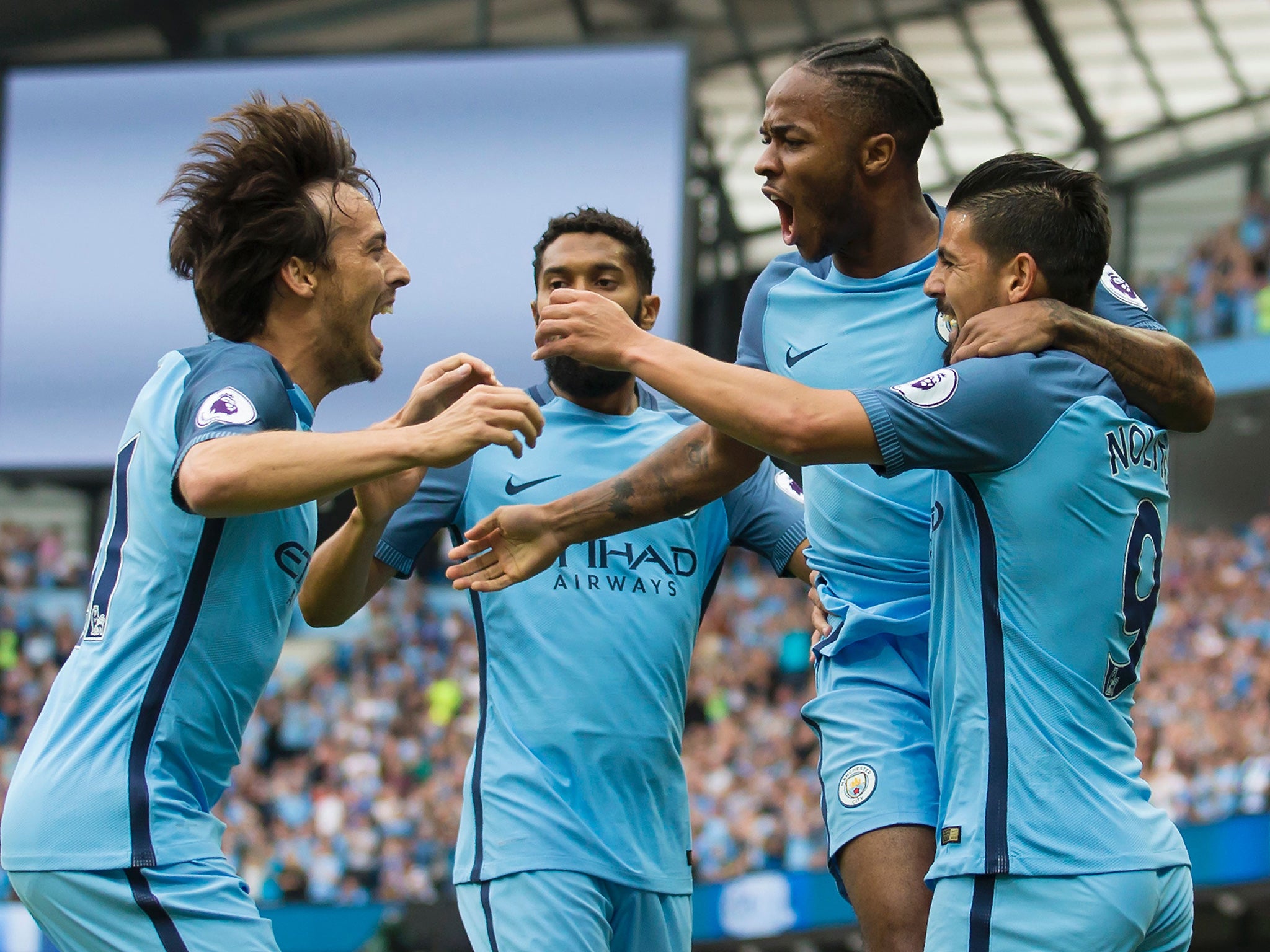 Sterling celebrates with his teammates after opening the scoring