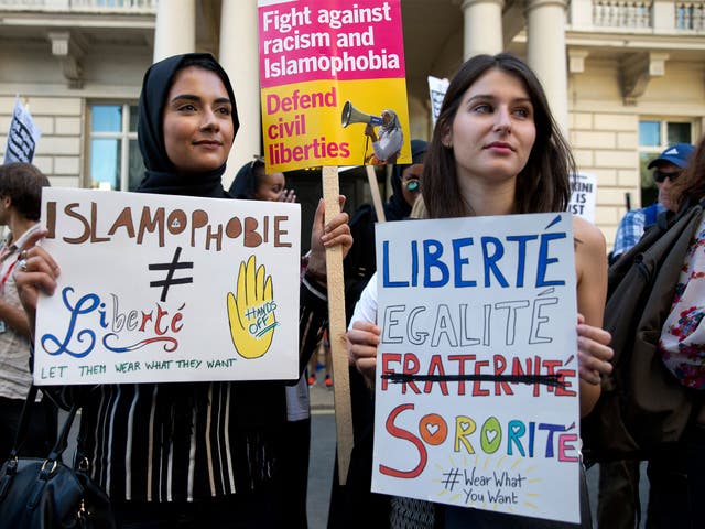 Women join a demonstration organised by 'Stand up to Racism' outside the French Embassy in London on August 26, against the Burkini ban on French beaches
