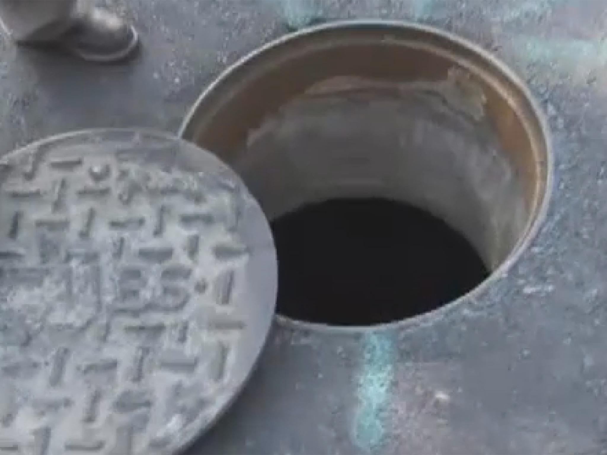 After lifting up an 80-pound manhole cover workers found clothes, toys and food