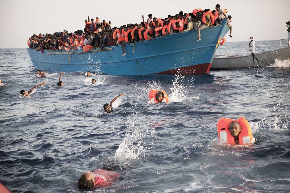 &#13;
One of the overcrowded wooden boats in rescue operations off Libya on 29 August (AP)&#13;