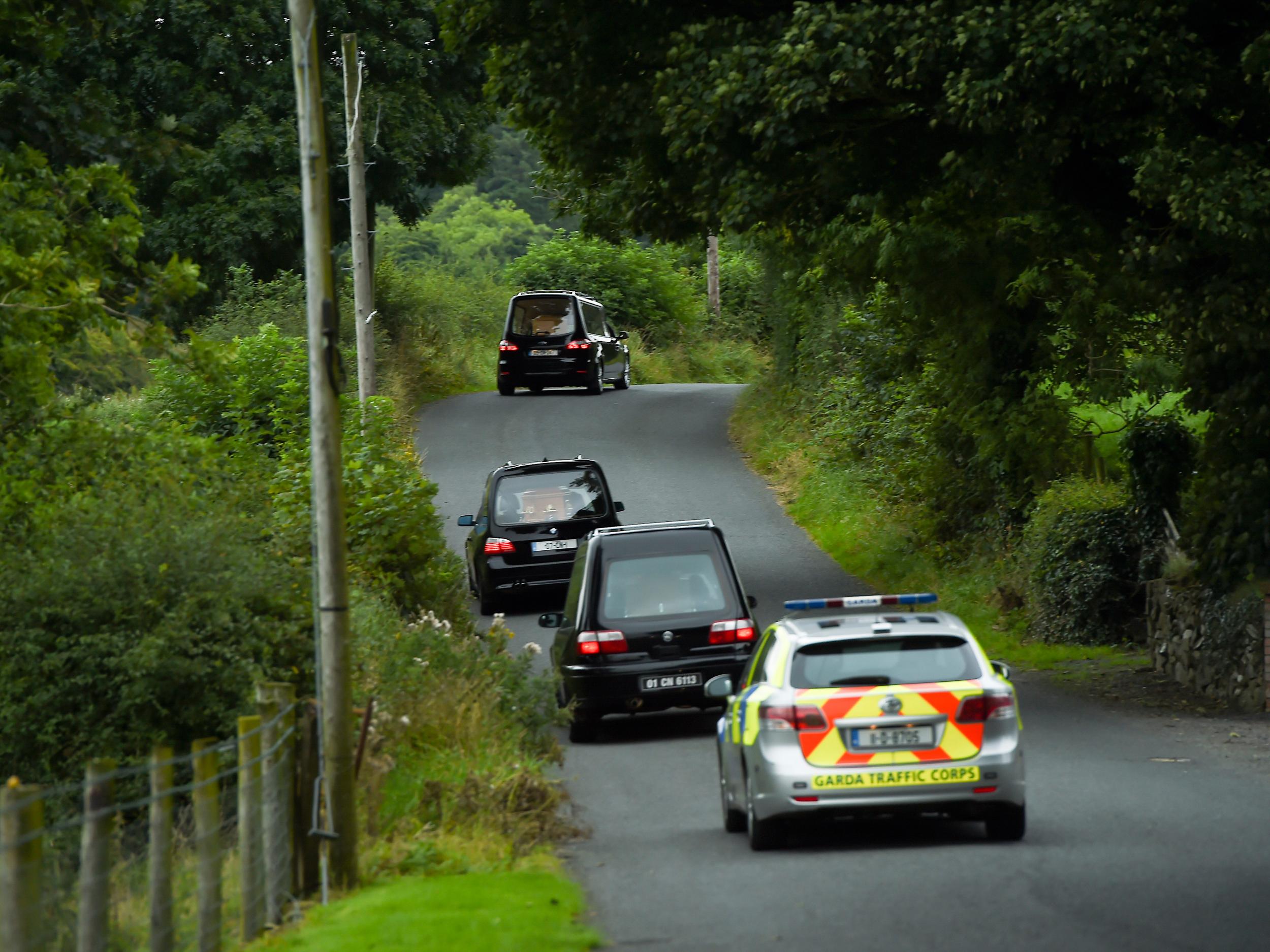 Hearses leaves the scene at Oakdene, Barconey, Ballyjamesduff in Cavan, where a family of five were found dead in their countryside home