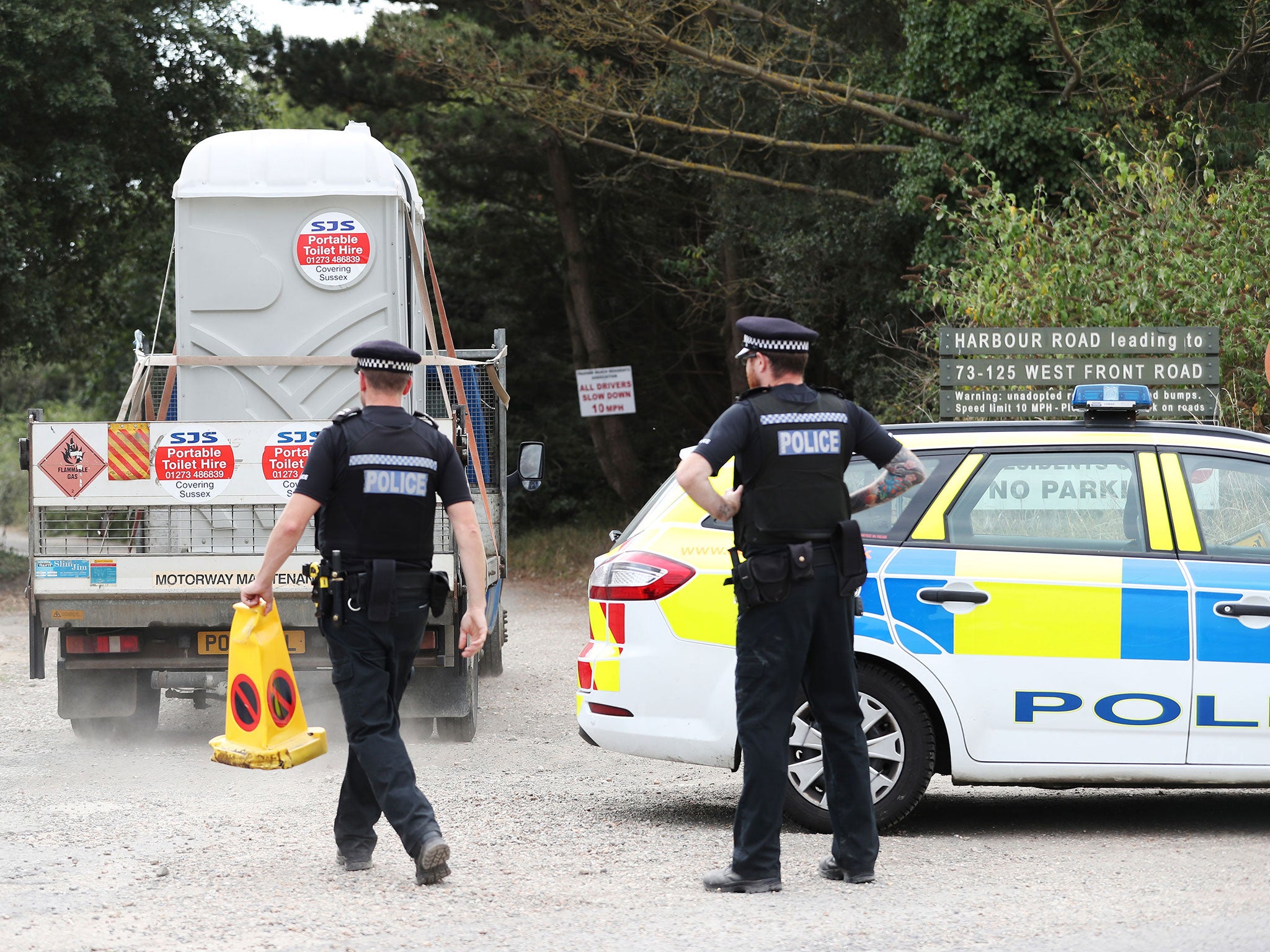 Armed police at the scene on Harbour Road, Pagham, where they are in a stand-off with a 72-year-old man who is thought to have a gun.