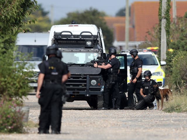 Armed police at the scene on Harbour Road, Pagham, where they are in a stand-off with a 72-year-old man who is thought to have a gun.