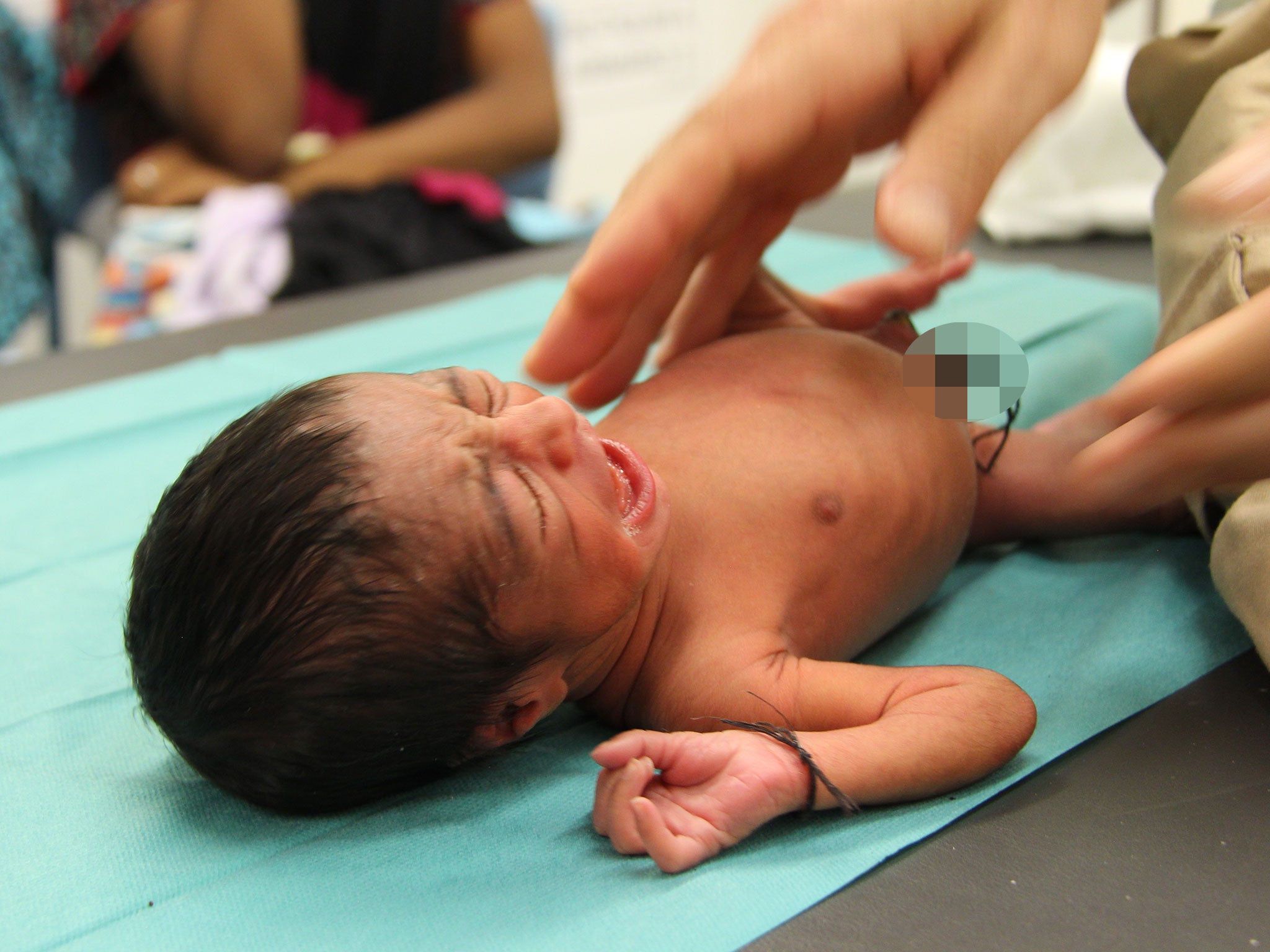 One of the five-day-old twins rescued by the MSF vessel the Dignity I off the coast of Libya on 29 August