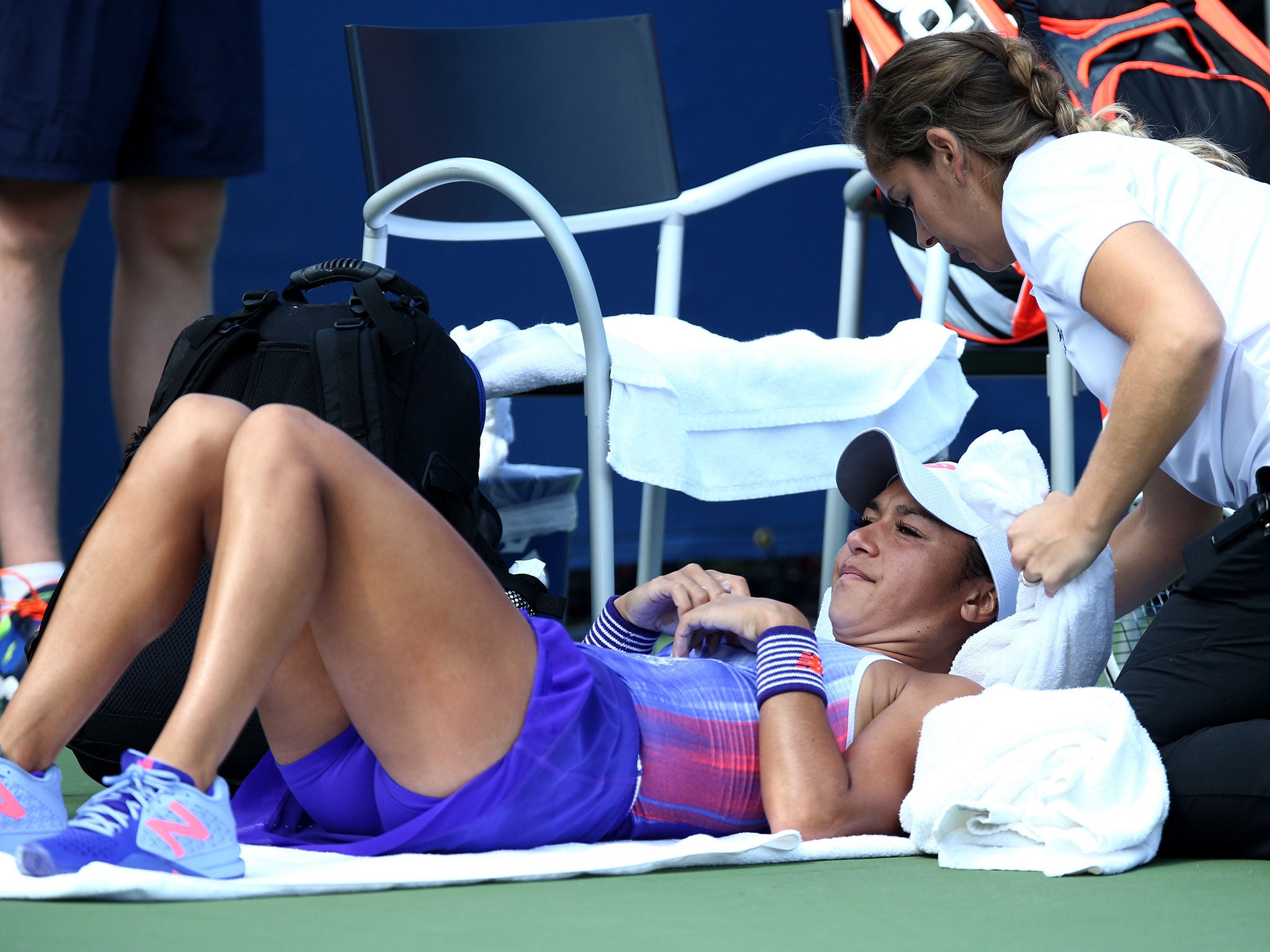 Heather Watson needs medical attention during her defeat at the US Open
