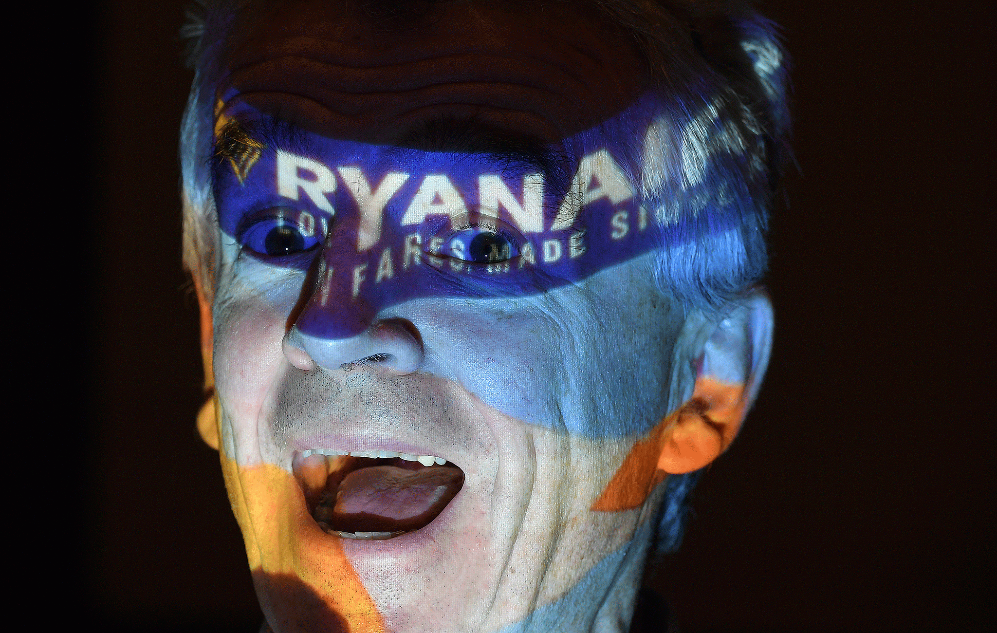 Ryanair chief executive Michael O'Leary poses in front of a projection screen following a news conference in London