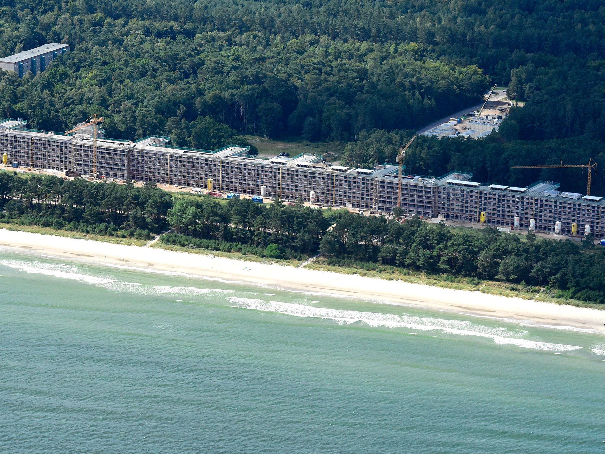 This aerial picture taken on 18 August, 2016 shows recently created luxury apartments at the site of the heritage-protected Prora Complex in Prora, near Binz, on the island of Ruegen