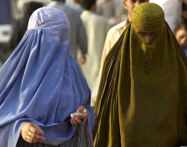 Two women wearing burkas 