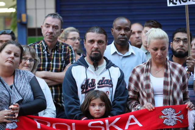People attend a vigil in Harlow to pay tribute to Arkadiusz Jozwik