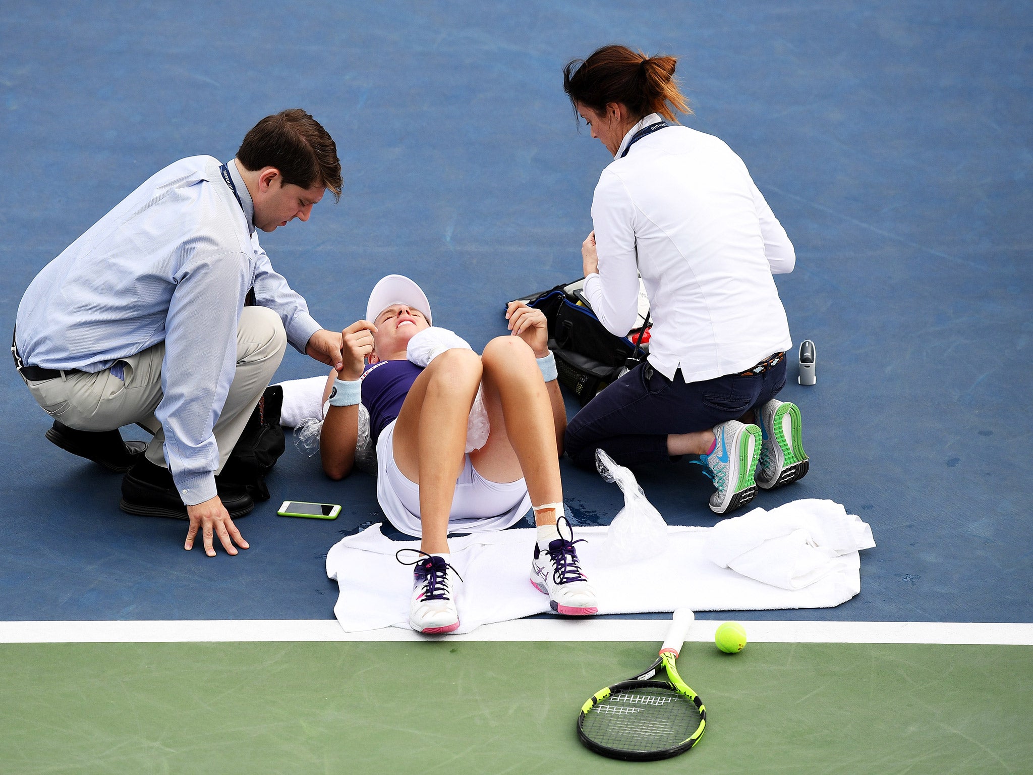 Johanna Konta receives treatment after collapsing during her US Open second round match